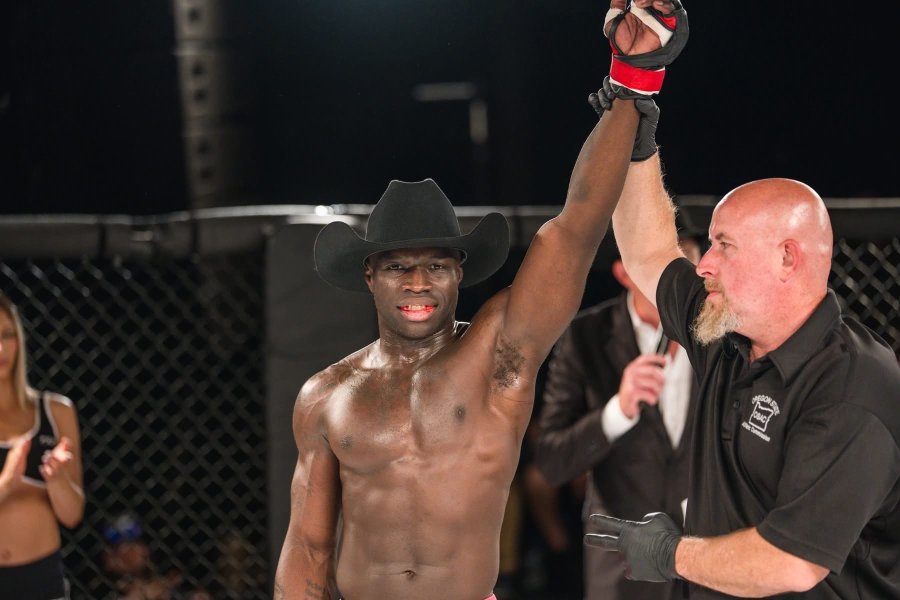 Referee raising Black Lightning's hand